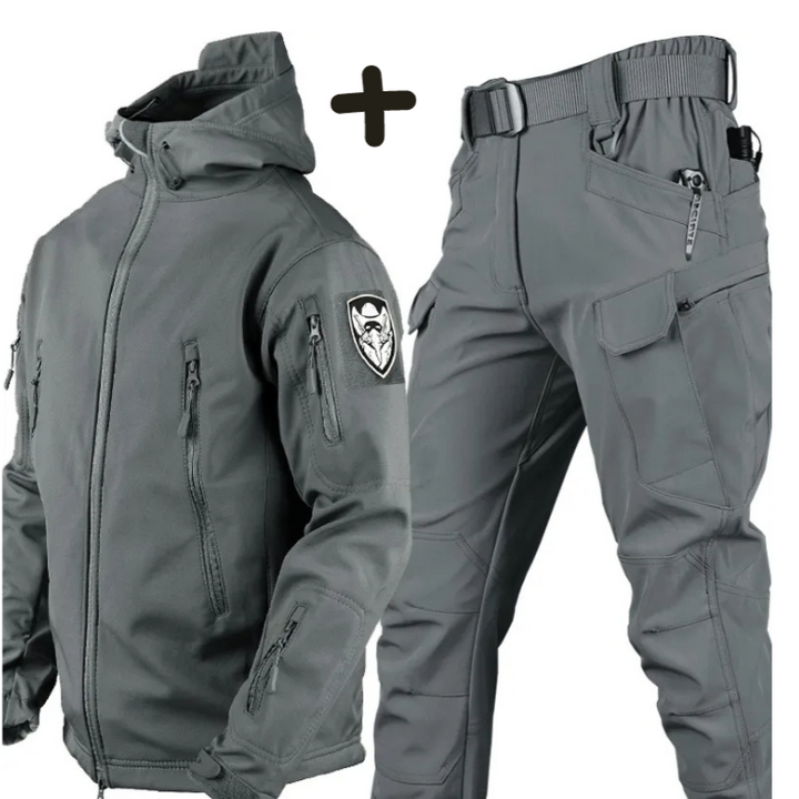 Man wearing full tactical hooded jacket & cargo pants set. Perfect matching set for rugged outdoor utility.