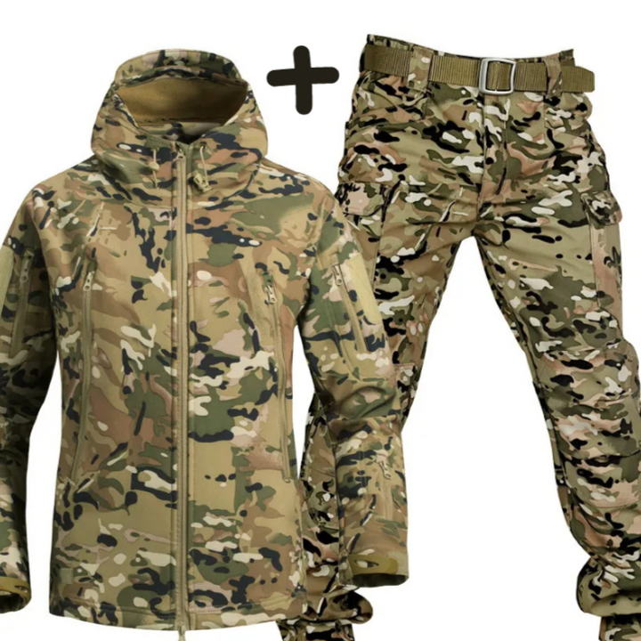 Detailed view of durable fabric on men's tactical jacket and cargo pants. High-quality outdoor adventure wear.