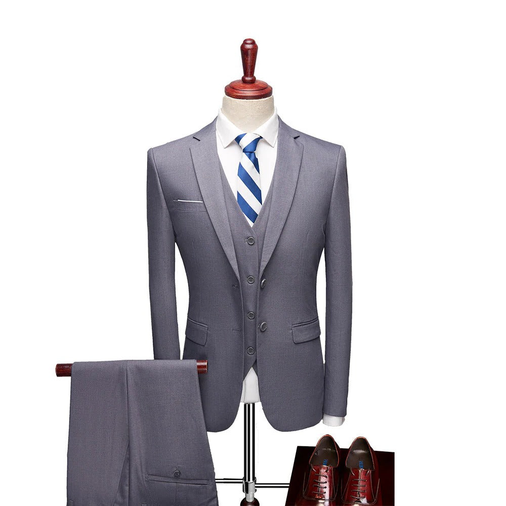 Close-up of men's tailored 3-piece spring suit fabric, showcasing waistcoat and jacket details.