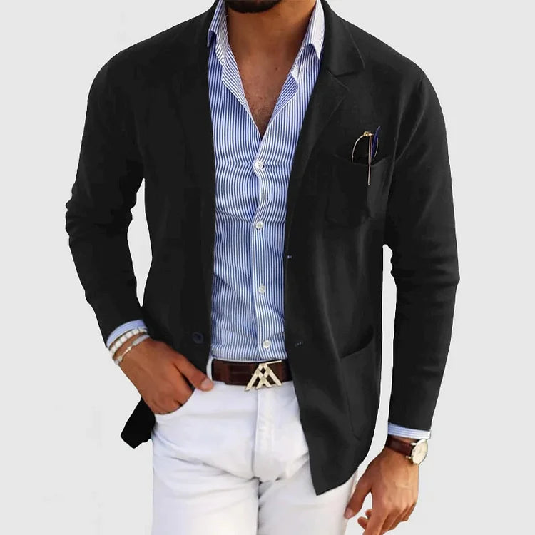 Man wearing a stylish tailored fit blazer with notch lapel. Perfect men's long sleeve jacket for formal events.