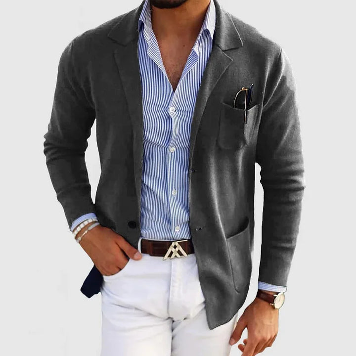High-quality men's tailored blazer with notch lapel. Long sleeve, pocketed for business & smart casual style.