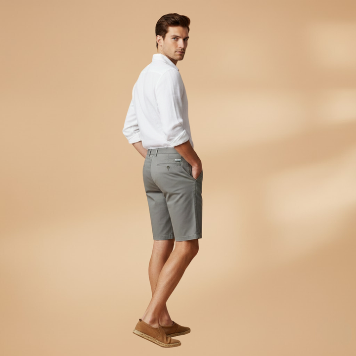 Modern fit men's tailored shorts, knee-length, comfortable for everyday wear with side pockets.