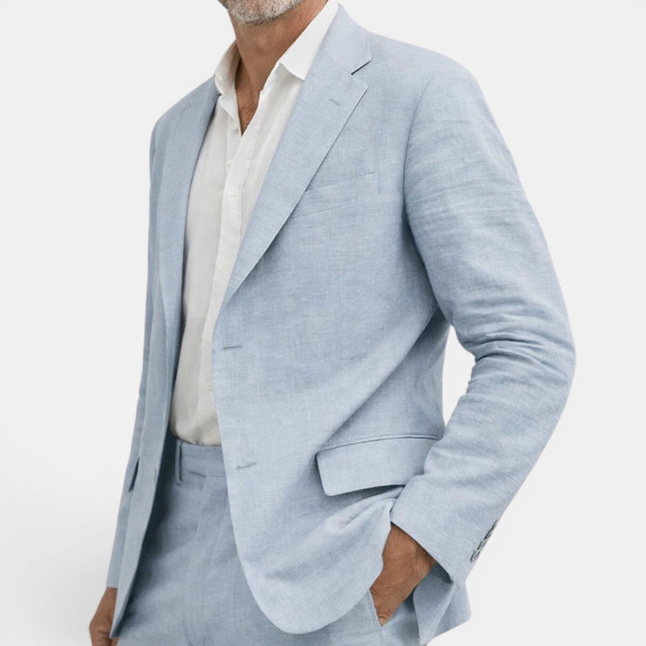 Sophisticated men's blue tailored suit, a two-piece blazer and pants set. Ideal for formal wear & special events.