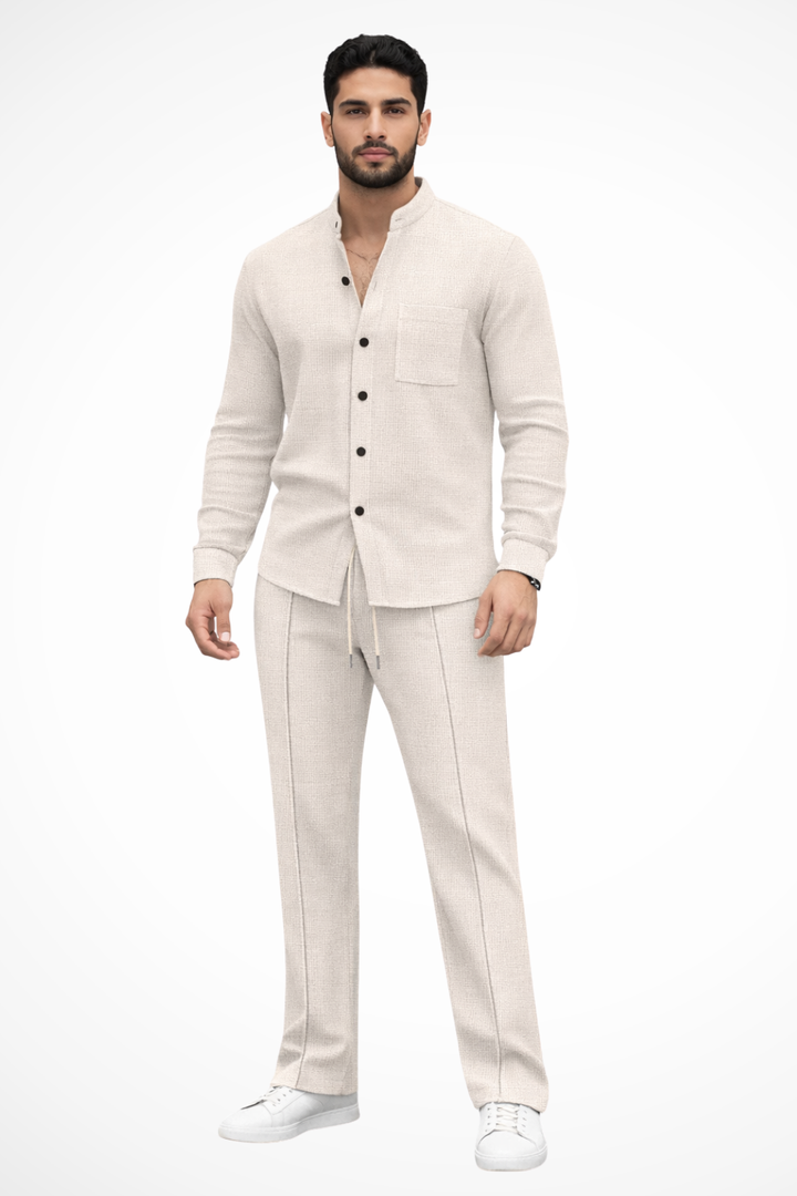 Complete menswear look: textured button shirt and adjustable waist trousers set.