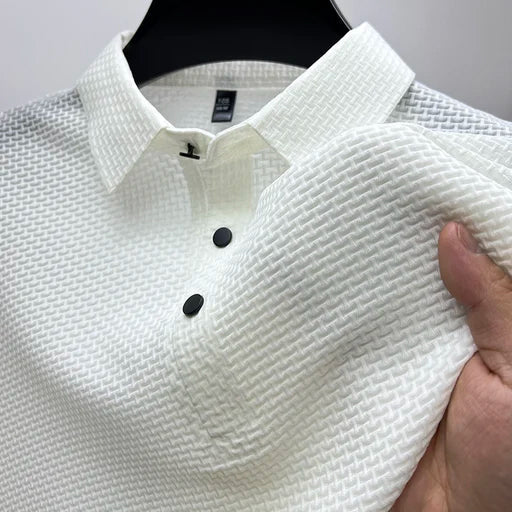 Man wearing a smart casual textured polo shirt with convenient snap button neckline
