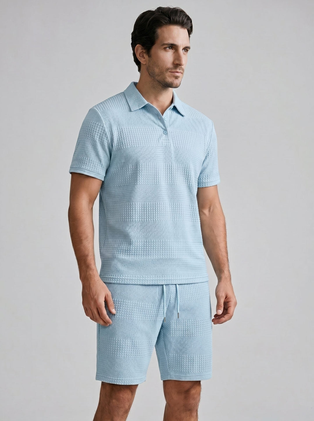 Comfortable men's textured short set. Includes a polo shirt and matching shorts.