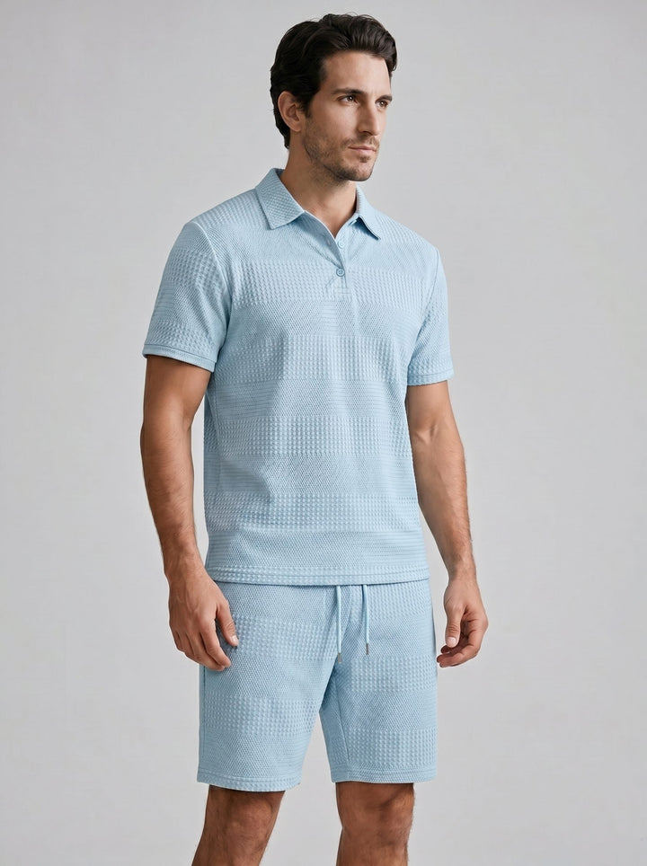 Comfortable men's textured short set. Includes a polo shirt and matching shorts.