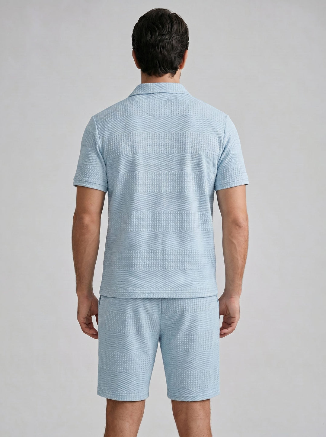 Men's textured polo shirt with matching shorts. A smart casual summer outfit.