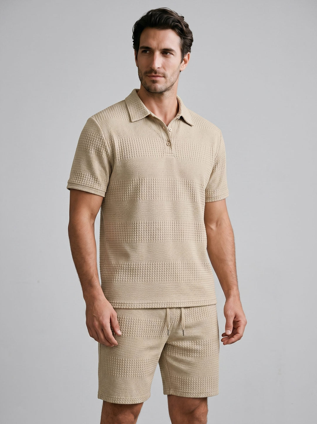 Men's fashion ensemble: Textured polo shirt, button details, and comfortable shorts.