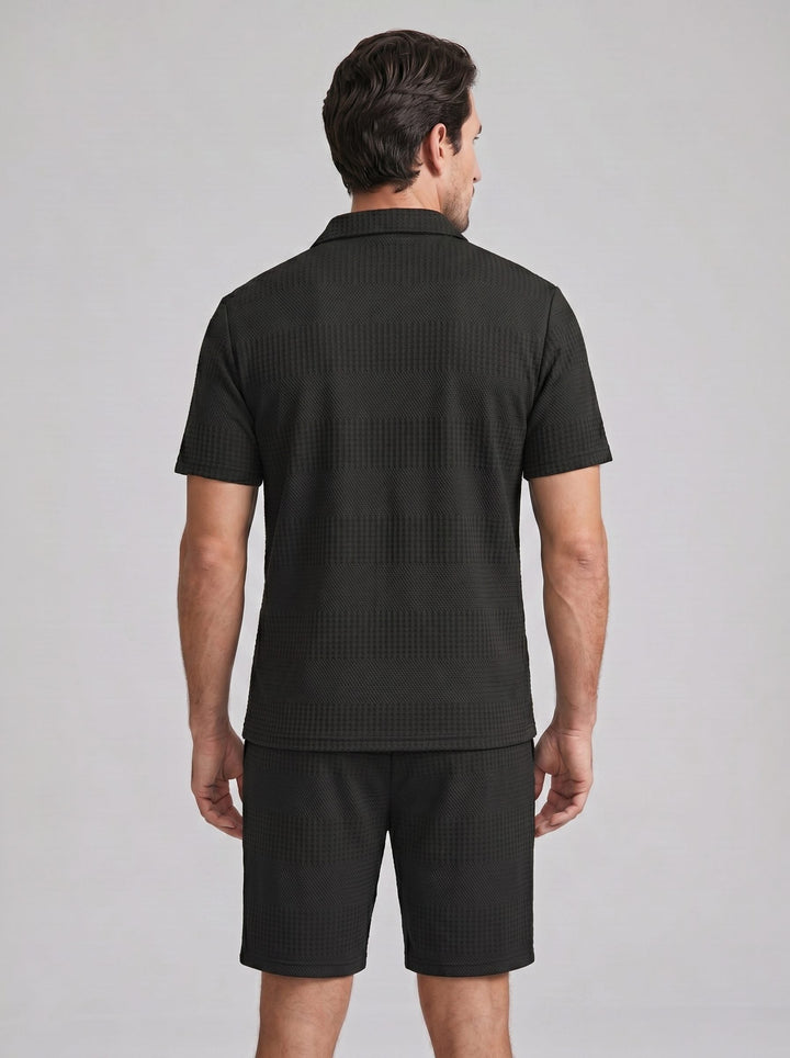 Modern men's casual outfit: Textured polo shirt & shorts set in a solid color.