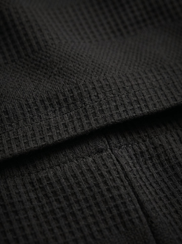 Men's two-piece textured summer set. Polo shirt and shorts for ultimate comfort.