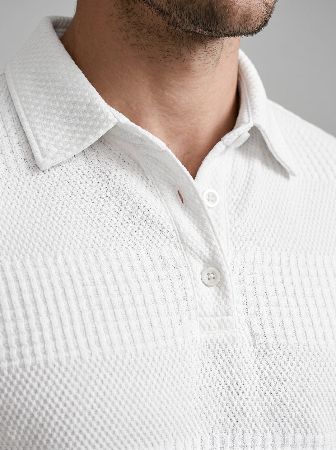 Relaxed comfort in a men's textured polo shirt and matching shorts set. Summer loungewear.