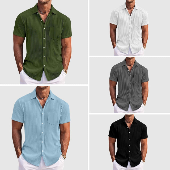 Model wearing a men's textured short sleeve button-front shirt for a relaxed look.