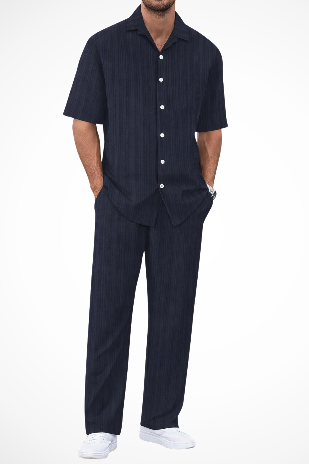 Model wearing men's textured short sleeve shirt and trouser summer set