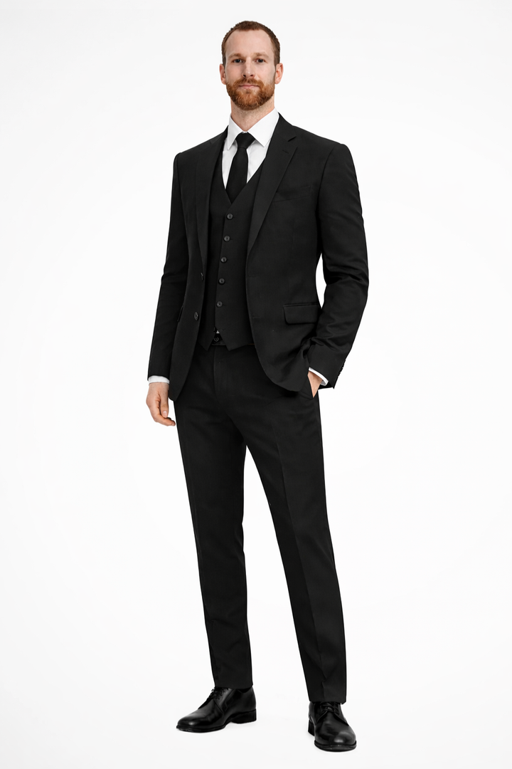 Men's three-piece suit: navy blue blazer, trousers, and waistcoat for wedding guests.