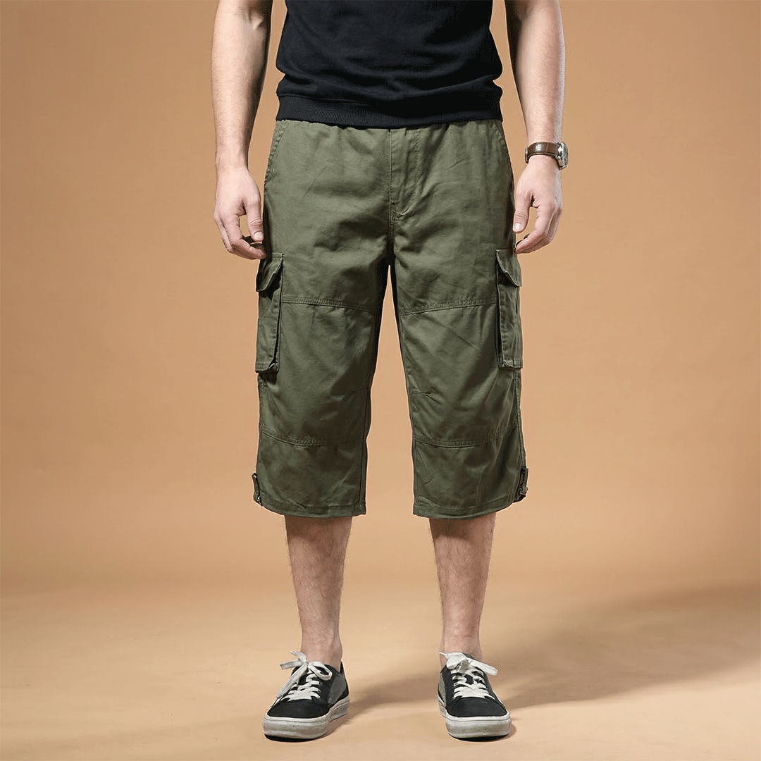 Comfortable men's trousers hitting below the knee, featuring convenient pockets.