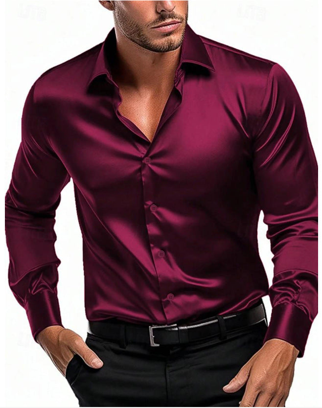 Stack of men's classic style button-down shirts in various colors.