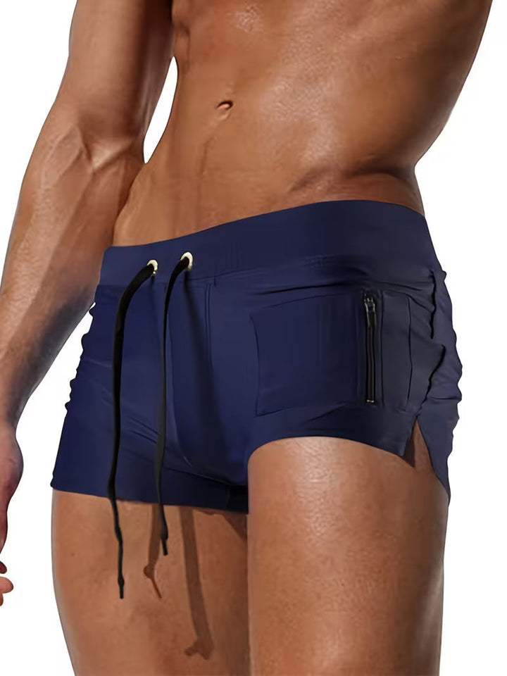 Modern men's swimwear: trendy zipper boxer shorts in vibrant blue, essential for summer fashion & holiday wear.