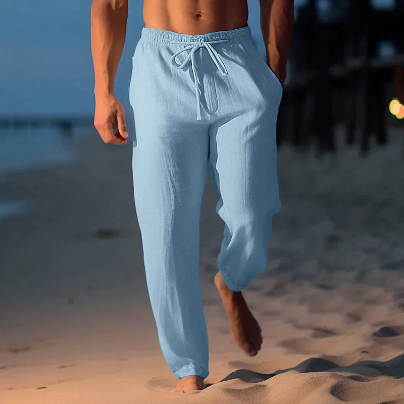 Relaxed fit men's casual pants with elastic waist & drawstring, ideal for summer comfort & style.