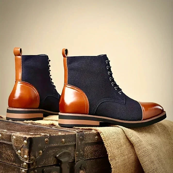 Men's hybrid ankle boots feature a two-tone design. Blends dress boot style with casual comfort. Versatile footwear.