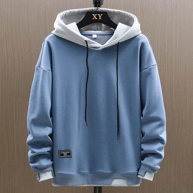 Men's two-tone streetwear hoodie featuring a contrasting color hood and casual pullover design.