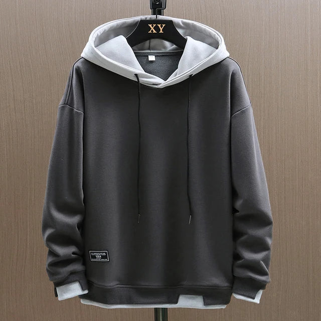 Casual streetwear pullover hoodie for men, showcasing a unique two-tone look with a contrast hood.