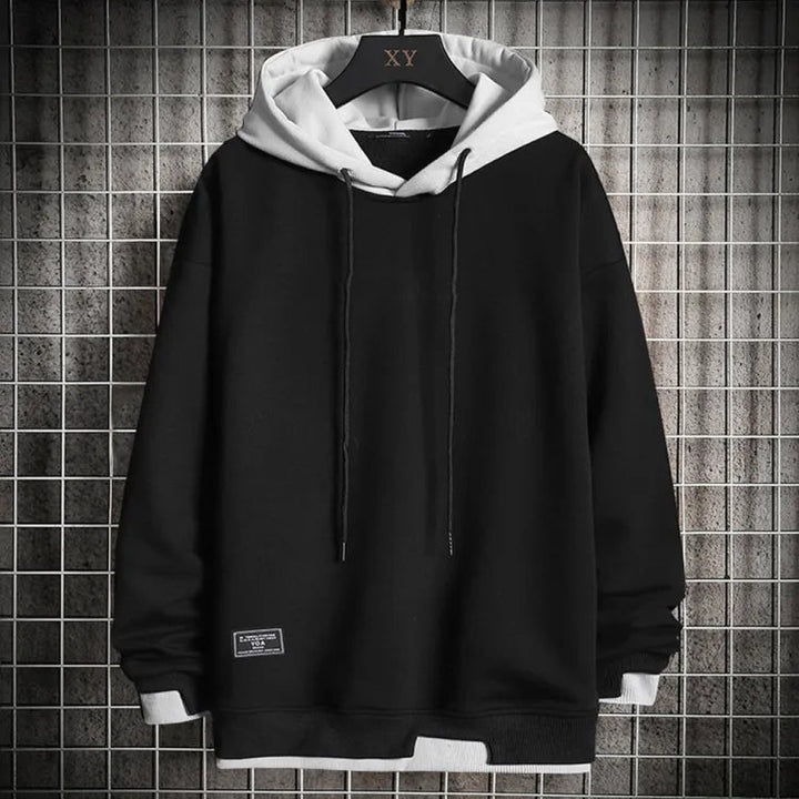 Warm winter wear: Men's two-tone hoodie with a comfortable contrast hood for ultimate streetwear style.