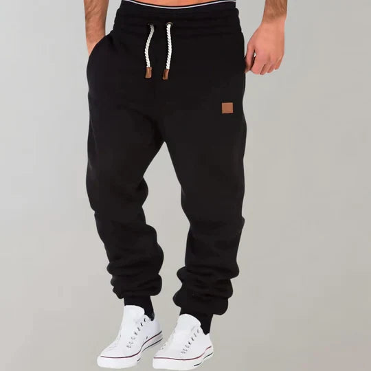 Men's comfortable lounge pants with an adjustable drawstring waist. Relaxed fit activewear bottoms for ultimate everyday comfort.
