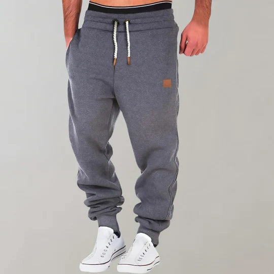 Ultimate comfort men's casual pants for jogging, lounging, or daily wear. Soft fabric athletic joggers with a relaxed fit.