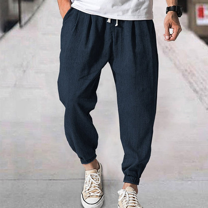 Full-length view of men's ultra-comfort jogging pants, showcasing relaxed fit & modern everyday style.