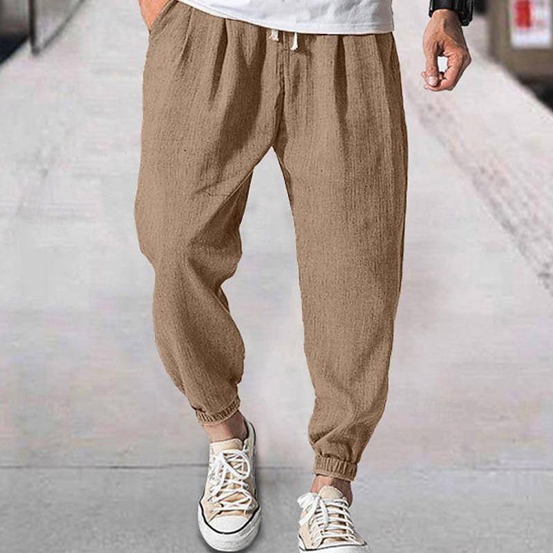 Folded men's ultra-comfort jogging pants, emphasizing soft fabric & premium everyday casual wear quality.
