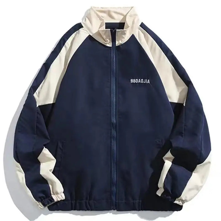 Lightweight men's windbreaker jacket with modern color-block design. Urban style for effective weather protection.