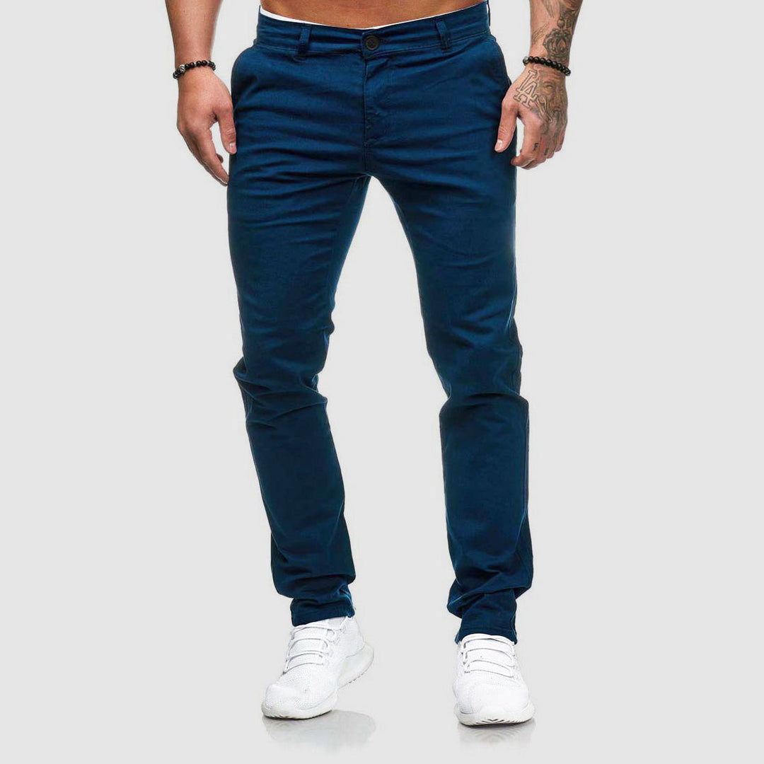 Man wearing urban slim fit chino pants, showcasing their effortless style and comfortable fit.