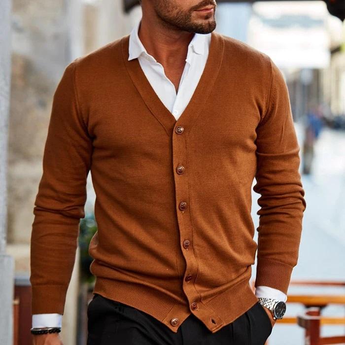 Close-up of the textured knit fabric on a men's V-neck cardigan sweater.