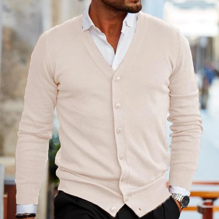 Detail shot of the button-up fastening on a soft, comfortable men's knit cardigan.