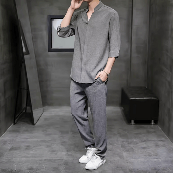 Black men's casual V-neck linen set with breathable fabric, ideal two-piece outfit for relaxed summer style.