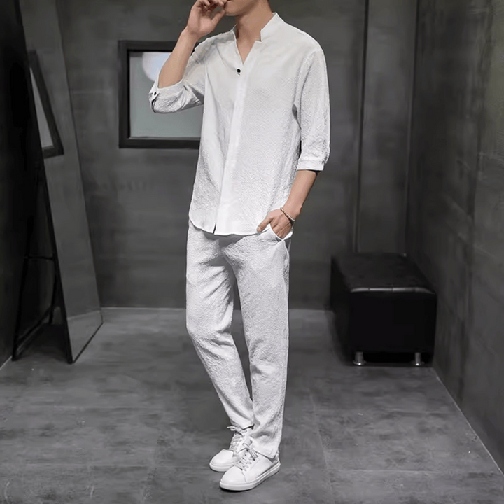Breathable men's V-neck linen two-piece outfit with drawstring pants, offering a relaxed fit for weekend wear.