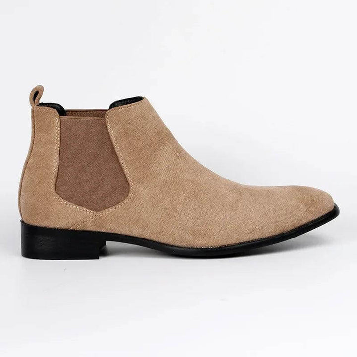 Beige suede men's Chelsea boots, offering a modern and versatile casual look. Comfortable ankle footwear.