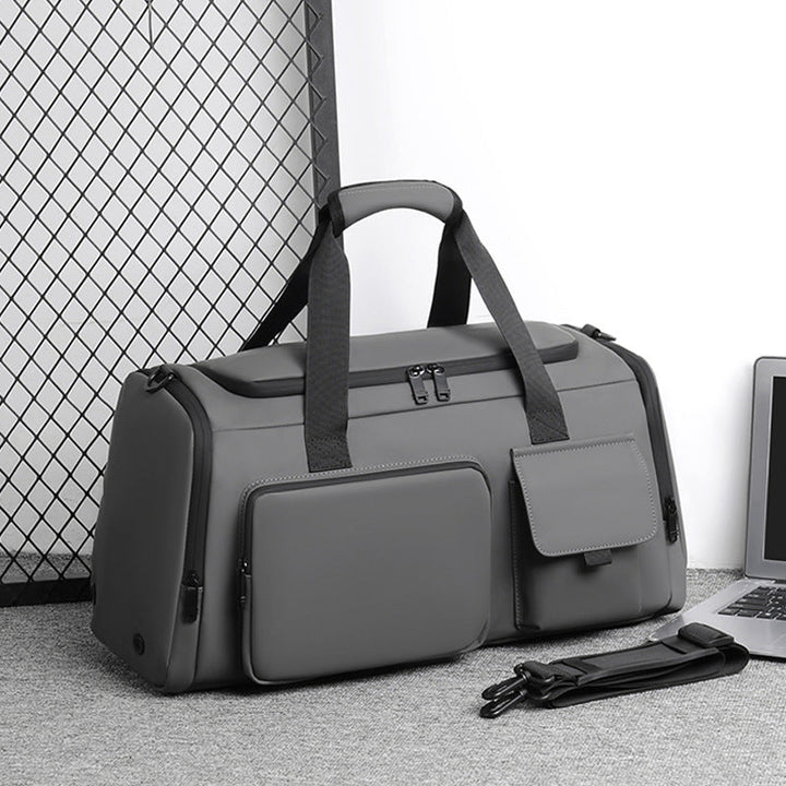 Men's versatile black duffel bag for travel, gym & sports. Water-repellent weekend bag with organized compartments.