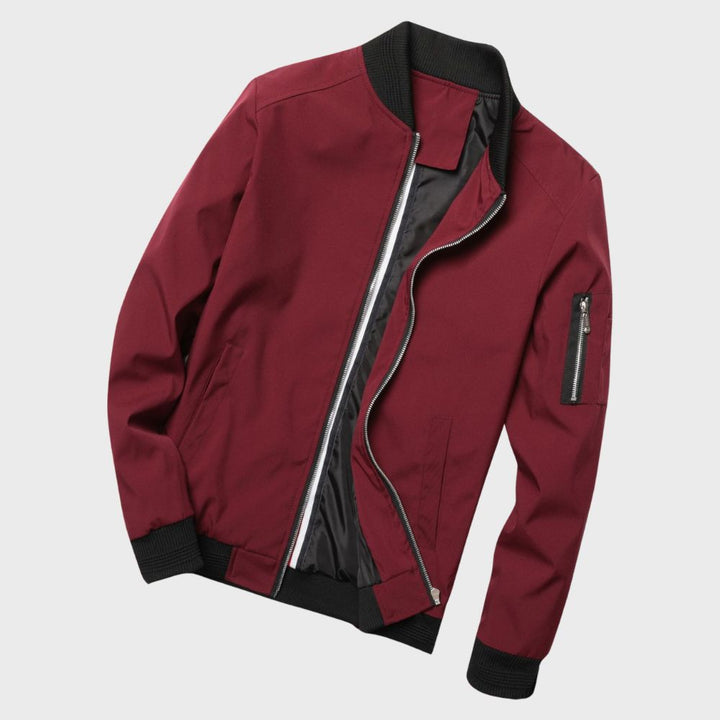 Stylish grey men's bomber jacket with full zip and ribbed cuffs, ideal for fall/spring fashion.
