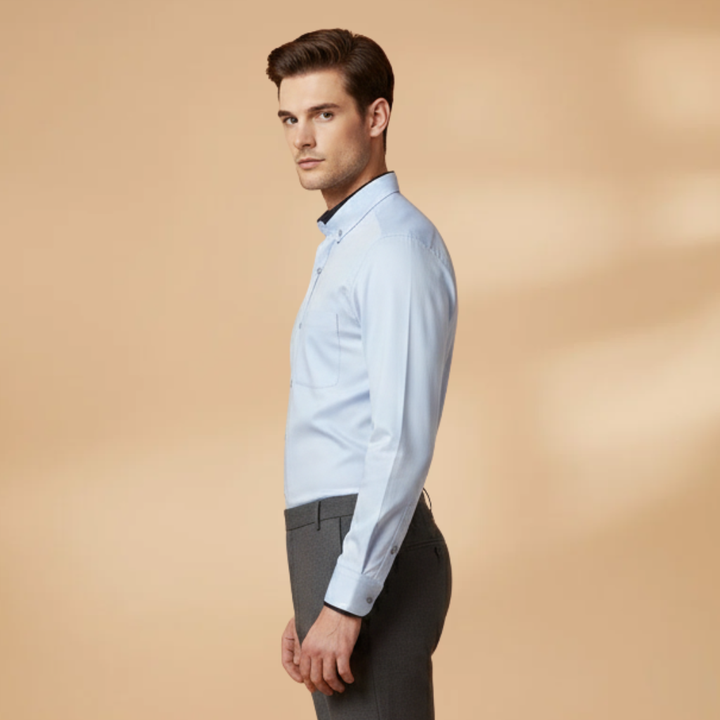 Relaxed fit men's long sleeve collared shirt. Soft fabric, adjustable cuffs. Versatile for smart casual styling.