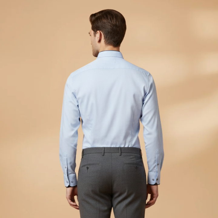 Men's collared long sleeve shirt with adjustable button cuffs. Versatile for smart casual or business casual menswear.