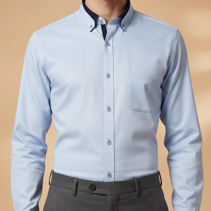 Navy blue men's long sleeve shirt, collared & adjustable cuffs. Perfect for versatile smart casual outfits.