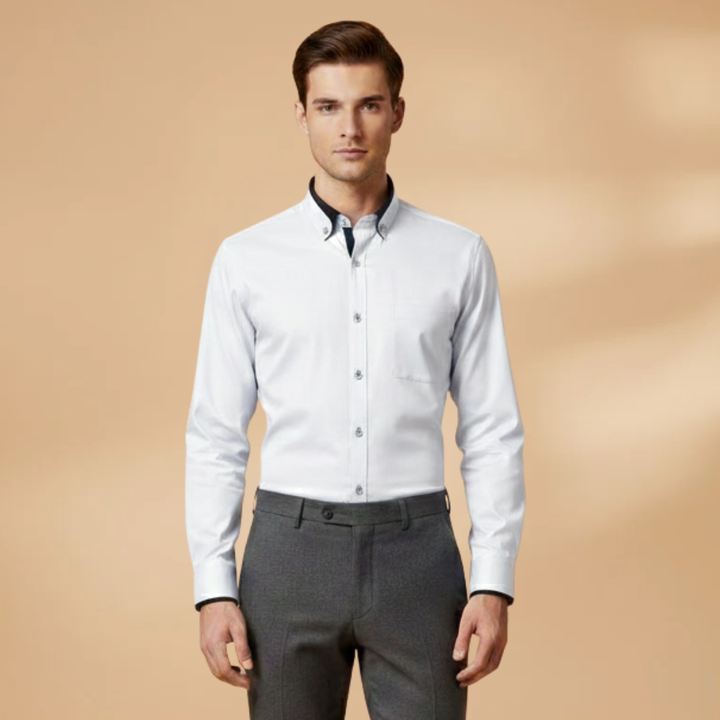 Man wearing a versatile long sleeve button-down shirt. Smart casual, collared, adjustable cuffs, perfect for daily wear.