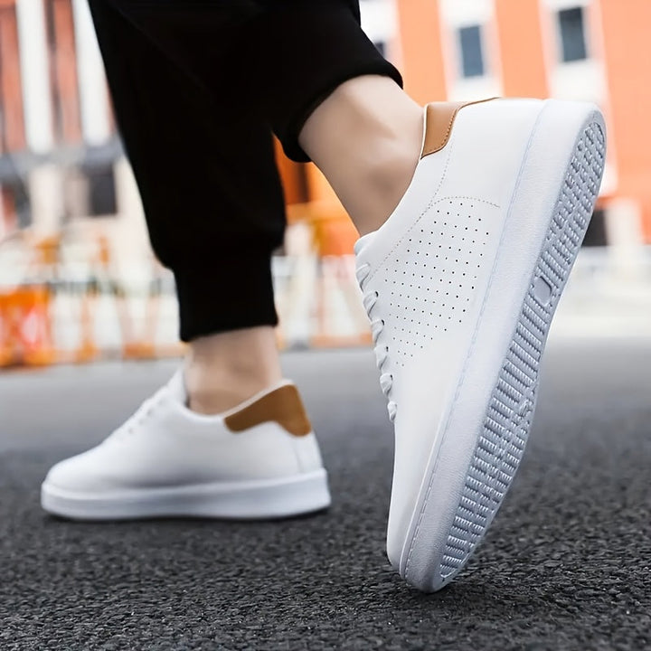 Classic men's white low-top trainers. Comfortable everyday casual sneakers for versatile style.