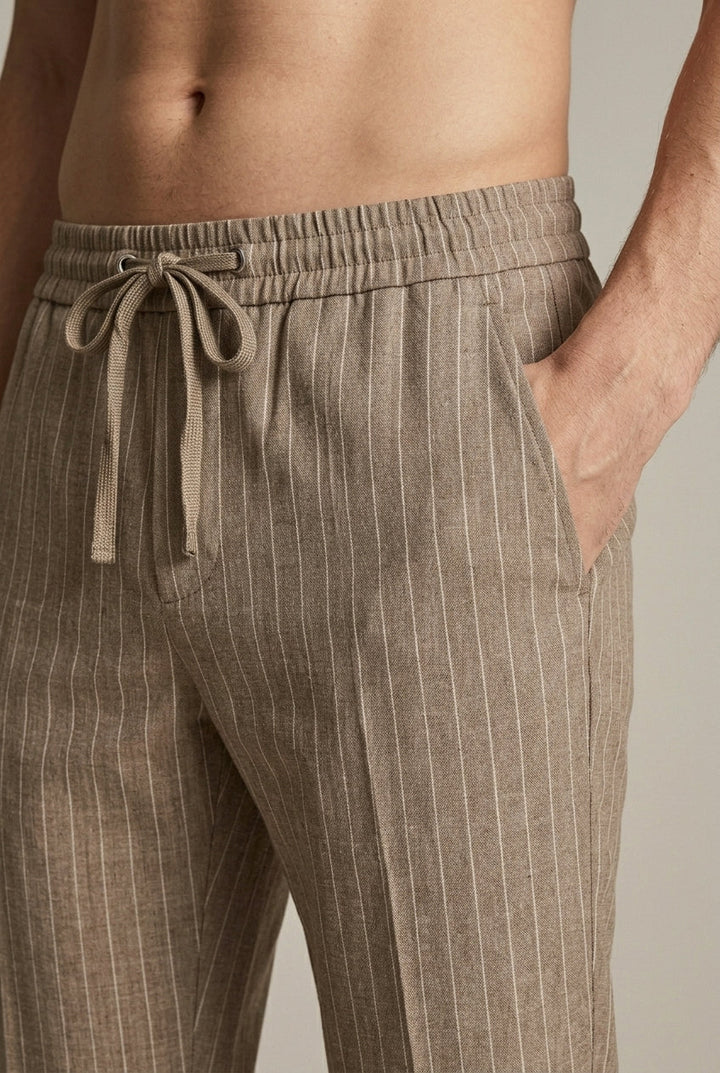 Smart casual men's pinstripe tapered trousers, perfect for versatile formal or relaxed summer looks.