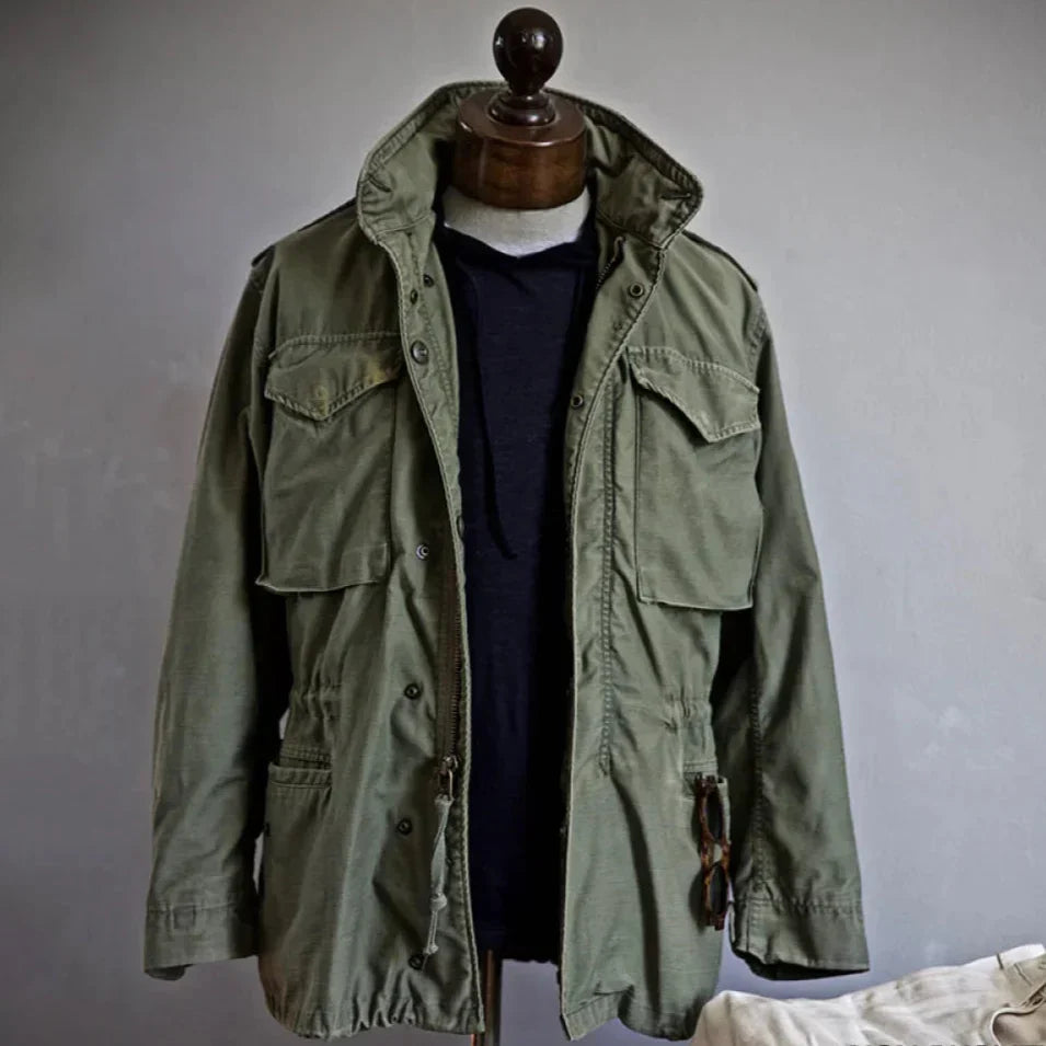 Black men's vintage field jacket, offering an adjustable waist and rugged style for everyday wear.