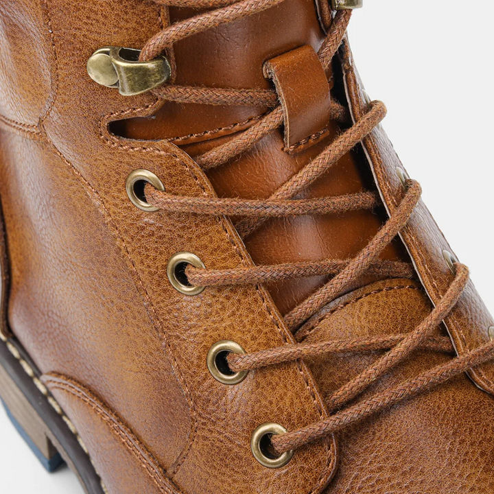 Rugged sole detail on men's durable leather lace-up ankle boots