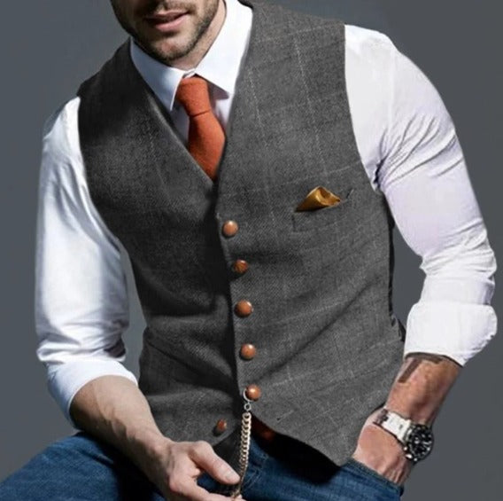 Front button detail on a men's lapel collar waistcoat, exuding timeless elegance