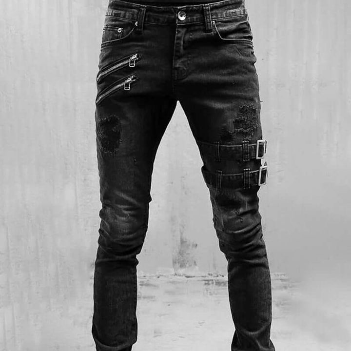 Edgy men's straight leg denim jeans. Vintage wash with distinctive buckle accents and distressed details.